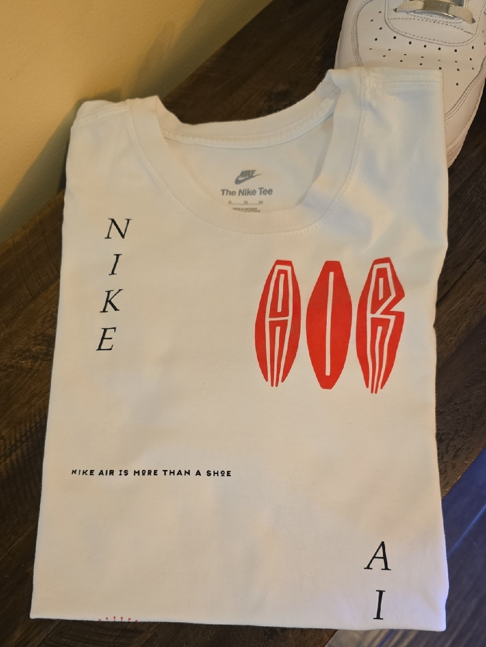 Mens Nike White Tee with Red Graphic Accents